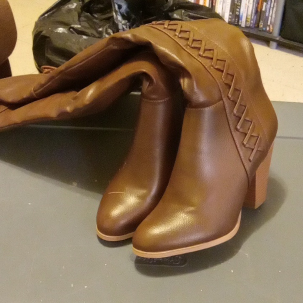 Brown knee high heeled boots